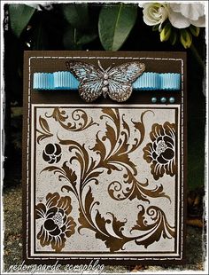 a card with a butterfly and flowers on it