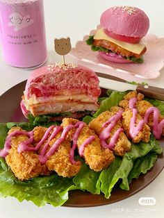 a plate with some food on it next to a pink cup and glass container filled with liquid