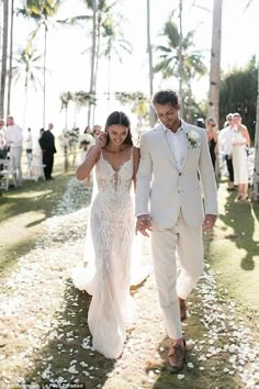 a newly married couple walking down the aisle