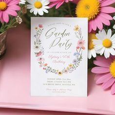 a pink and yellow floral birthday party with daisies