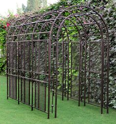 an iron garden trellis in the grass