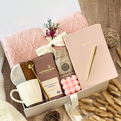 an open box with some items in it on a table next to other items and yarn