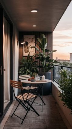 a balcony with two chairs and a table on it