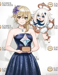 a woman in a blue dress holding an award for the game awards, with another girl standing next to her