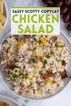 chicken salad on a white plate with grapes and crackers in the background text says sassy scotty copycat chicken salad