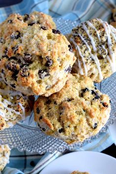 cookies and muffins are on a glass plate