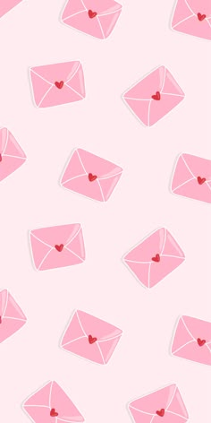 pink envelopes with hearts on them are shown in this seamless pattern, which is also available for wallpaper