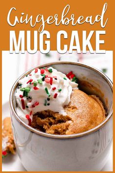 gingerbread mug cake in a cup with whipped cream and sprinkles on top