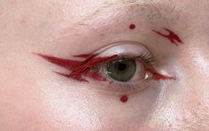 Red graphic liner with dots Punk Graphic Liner, Red White Makeup, Graphic Makeup Eyeliner, Red Liner Looks, Red Eyeliner Makeup Looks, Red Graphic Makeup, Makeup With Dots, Red Liner Makeup, Red Graphic Eyeliner