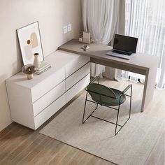 a laptop computer sitting on top of a white desk next to a chair and window