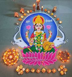 an image of the hindu god sitting on top of a flower with candles around it