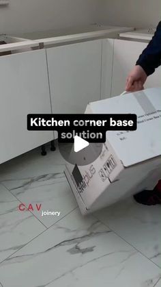 a man is opening a box in the kitchen with an ad that reads kitchen corner base solution