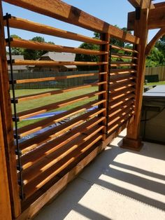 a wooden fence on the side of a house