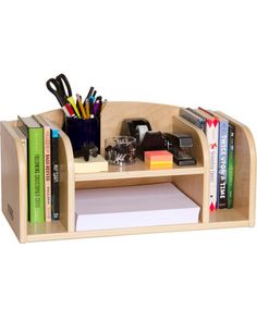 a wooden desk with books, pens and other office supplies on top of the shelf