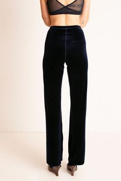 High waist pants in a stretch velvet. Elastic waistband and a slightly flared leg. Fabric is 90% polyester, 10% elastane. Ella is 6' tall, 35" bust, 26" waist, 36" hip, and is wearing a size S. Anthropologie Blue Velvet Flare Pants, Luxury Velvet Wide Leg Pants Elegant, Luxury Velvet Wide Leg Bottoms, Blue Velvet Flare Pants, Velvet Pants Lulus, Ribbed Velvet Pants, Velvet Tapered Pants, Luxury Wide Leg Velvet Pants, Luxury Velvet Wide Leg Pants