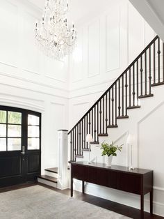 the inside of a house with stairs and chandelier above it is instagramted