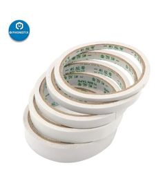 five rolls of white tape sitting on top of each other