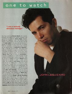 a man in a suit and tie sitting on top of a magazine page with his hand under his chin