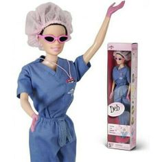 the doll is wearing a blue scrub suit and pink sunglasses