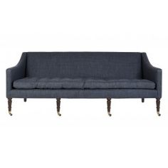 a gray couch with wooden legs on a white background