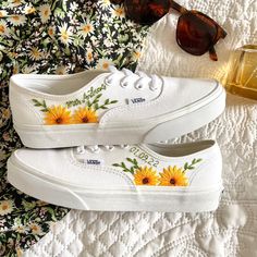 Fresh all white Vans Authentic trainers delicately hand embroidered with bold, bright sunflowers, rich green foliage and finished with a name, date, initials or words of your choice. Each pair is hand made to order and stitched with high quality embroidery thread which is washable and fade resistant.  If you're looking for something a little more bespoke, I offer a limited number of fully custom hand embroidered trainers tailored to your wishes. Consider your wedding theme, your favourite flowers, your bouquet and more all tailored to your budget. We can work together to create something perfect for you. Check out my Etsy store for the 'custom order' listing, please read item description before purchase. I'm on Instagram! Follow me @OliveString for extra design inspiration and sneak peeks White Vans Authentic, All White Vans, Embroidered Vans, Wedding Vans, Sunflower Vans, Embroidery Shoes, Embroidered Shoes, Stunning Shoes, White Vans