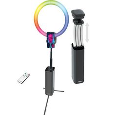 an image of a cell phone holder with a rainbow ring around it and a remote control