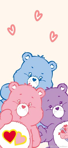 three teddy bears sitting next to each other with hearts on their chest and one bear holding a heart