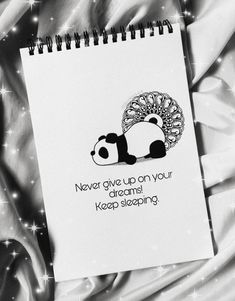 a notepad with a panda bear on it that says never give up on your dreams keep sleeping