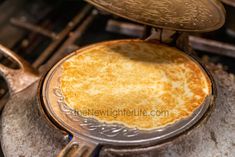 an old frying pan with some food cooking on it's burners in the oven