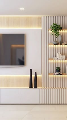 a living room with white walls and shelves filled with plants, vases and a flat screen tv mounted on the wall