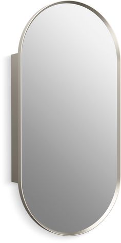 an oval mirror mounted on the wall with a metal frame and silver trim around it