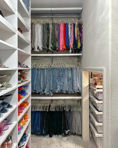 the closet is full of clothes and shoes