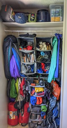 a closet filled with lots of luggage and bags