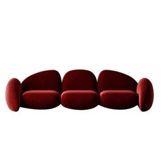 a red couch sitting on top of a white floor