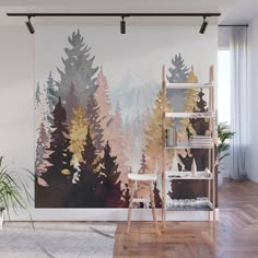 a wall mural with trees painted on it in a living room, next to a book shelf