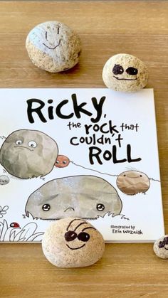 the rock that couldn't roll is next to three rocks with faces drawn on them