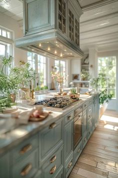 a kitchen filled with lots of counter top space next to a stove top oven and sink