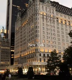 the new york building is lit up at night