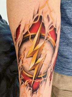 a man with a flash tattoo on his arm