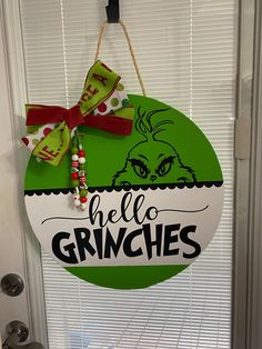 a door hanger that says, hello grinches