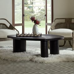 a living room with two chairs and a coffee table