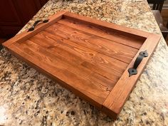 a wooden tray sitting on top of a counter