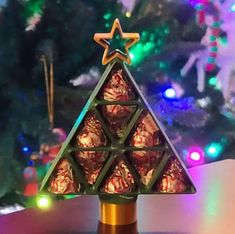 a small christmas tree made out of chocolates