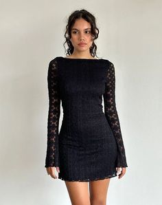 In a black regal lace, the Sevila dress features a mini, bodycon silhouette with long, flared sleeves and a boat neckline. Complete with scalloped hem detailing on a fully lined body. Lace Top Mini Dress, Sweater Dress Outfits, Lace Long Sleeve Mini Dress, Sabrina Neckline, Motel Rocks Dress, Long Sleeve Black Dress, Black Dress With Lace, Black Homecoming Dress, Elsa Dress