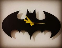 a clock with the shape of a batman symbol