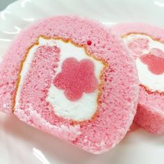 two pink heart shaped cakes on a white plate