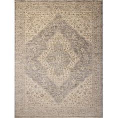 an antique rug with grey and beige colors