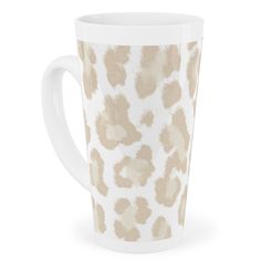 a white and brown leopard print coffee cup on a white background with the lid down