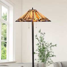 a living room scene with focus on the floor lamp