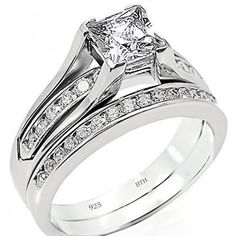 a wedding ring set with a princess cut diamond in the center and channeled shoulders